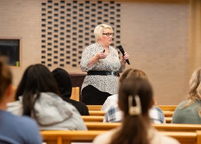 Jewel Yoder, director fo the nursing program at Goshen College, speaks with high school students for Nursing and Public Health Career Day