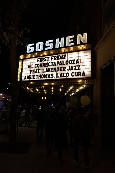 The theater sign lit up at night announcing Connectapalooza! and all the performances.