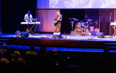 Musical artist Lalo Cura performs on the theater stage.