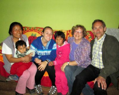 Duane and Karen pose with Danielle and members of her host family.