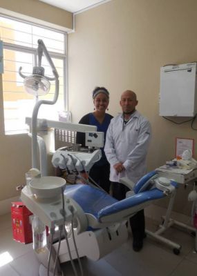 Asia with a dentist she assisted, Dr. Jorge Alarcón.