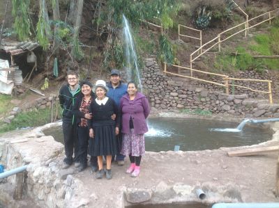 Alberto with his host mother, host grandmother, and host aunt and uncle by a trout pool.