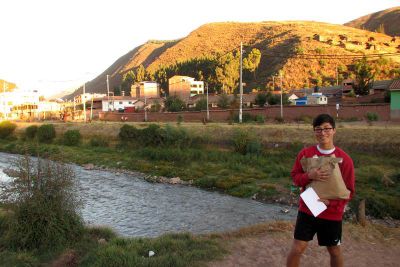 James meets us near the river to walk to his home.