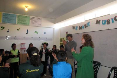 At Promesa school, Peter works with Brook to teach an elementary music class.