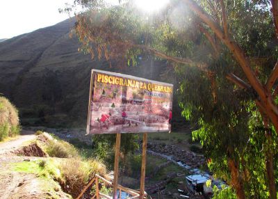 A sign above the trout farm shows that they are open for business.