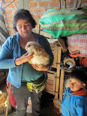 Nieves shows one of the family's rabbits.