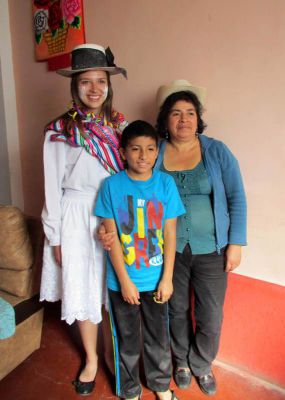 Morgan with her host mother, Nieves, and brother, Javier. Nieves wanted Morgan to try on a traditional dance costume.