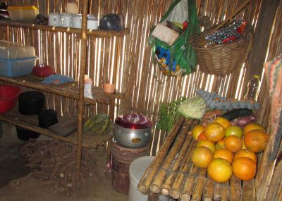 Plenty of yuca waits to be eaten on the floor of the kitchen.