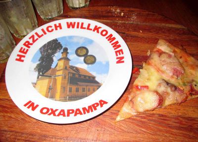 A plate at the pizza parlor hints at the Austrio-German background of Oxapampa.