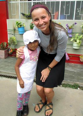 Claire with a little chef - cooking is a regular activity at the school, complete with uniforms.