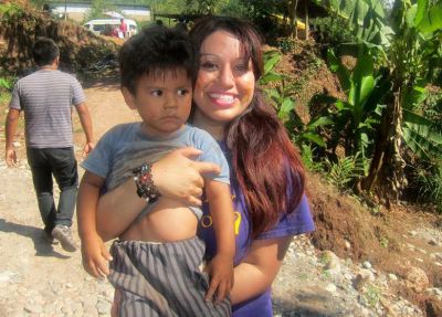 Jessica with a child from a local village.