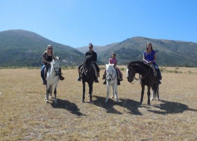 Kate, Asia, Wanda and Morgan on horses near the site where the Battle of Ayacucho took place.